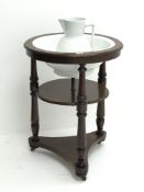 Early 19th century circular mahogany two tier washstand with ceramic bowl and jug,
