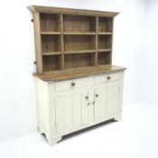 White painted and waxed pine dresser, two drawers and two cupboards, raised two heights plate rack,