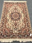 Persian design pale green ground rug, central medallion, repeating border,