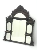 Late Victorian mahogany overmantle mirror, carved Prince of Wales feathers pediment, five shelves,