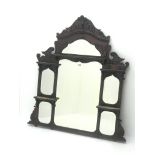 Late Victorian mahogany overmantle mirror, carved Prince of Wales feathers pediment, five shelves,