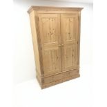 Solid pine wardrobe, projecting cornice, two doors enclosing hanging rail above two drawers,