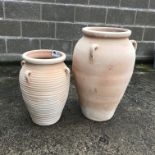 Large terracotta flagon (H70cm) and a similar smaller ribbed flagon (H53cm) (2)