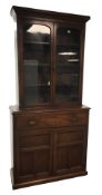 Early 20th century oak bookcase on secretaire, two glazed doors,
