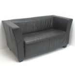 Two seat sofa upholstered in brown leather,