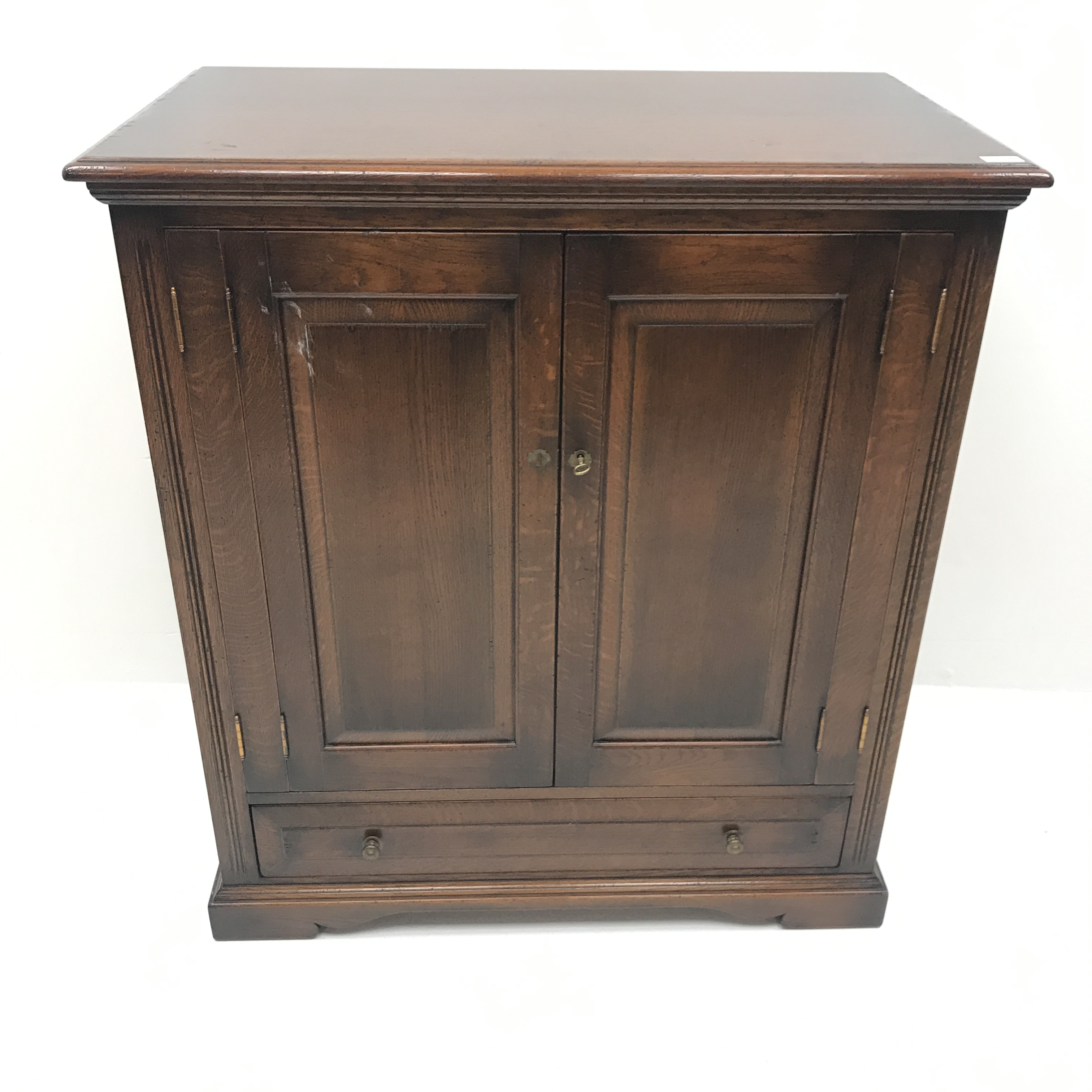 Traditional oak side cabinet, two cupboards above single drawer, shaped plinth base, - Image 2 of 3