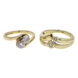 Gold two diamond stone crossover ring and one other similar set with two diamonds,