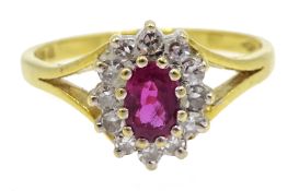 18ct gold oval ruby and round brilliant cut diamond cluster ring,