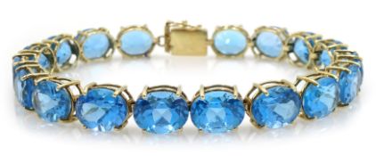 9ct gold oval Swiss blue topaz link bracelet, hallmarked Condition Report Approx 21.