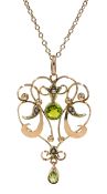Gold peridot and split seed pearl pendant, on gold necklace,