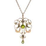 Gold peridot and split seed pearl pendant, on gold necklace,