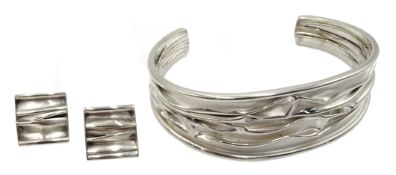 Silver contemporary design bangle and matching earrings,