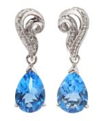 Pair of 9ct white gold pear shaped Swiss blue topaz and diamond pendant earrings,