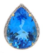 9ct gold pear shaped Swiss blue topaz, with diamond surround ring,