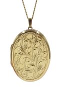 Gold locket pendant, engraved decoration on the front,