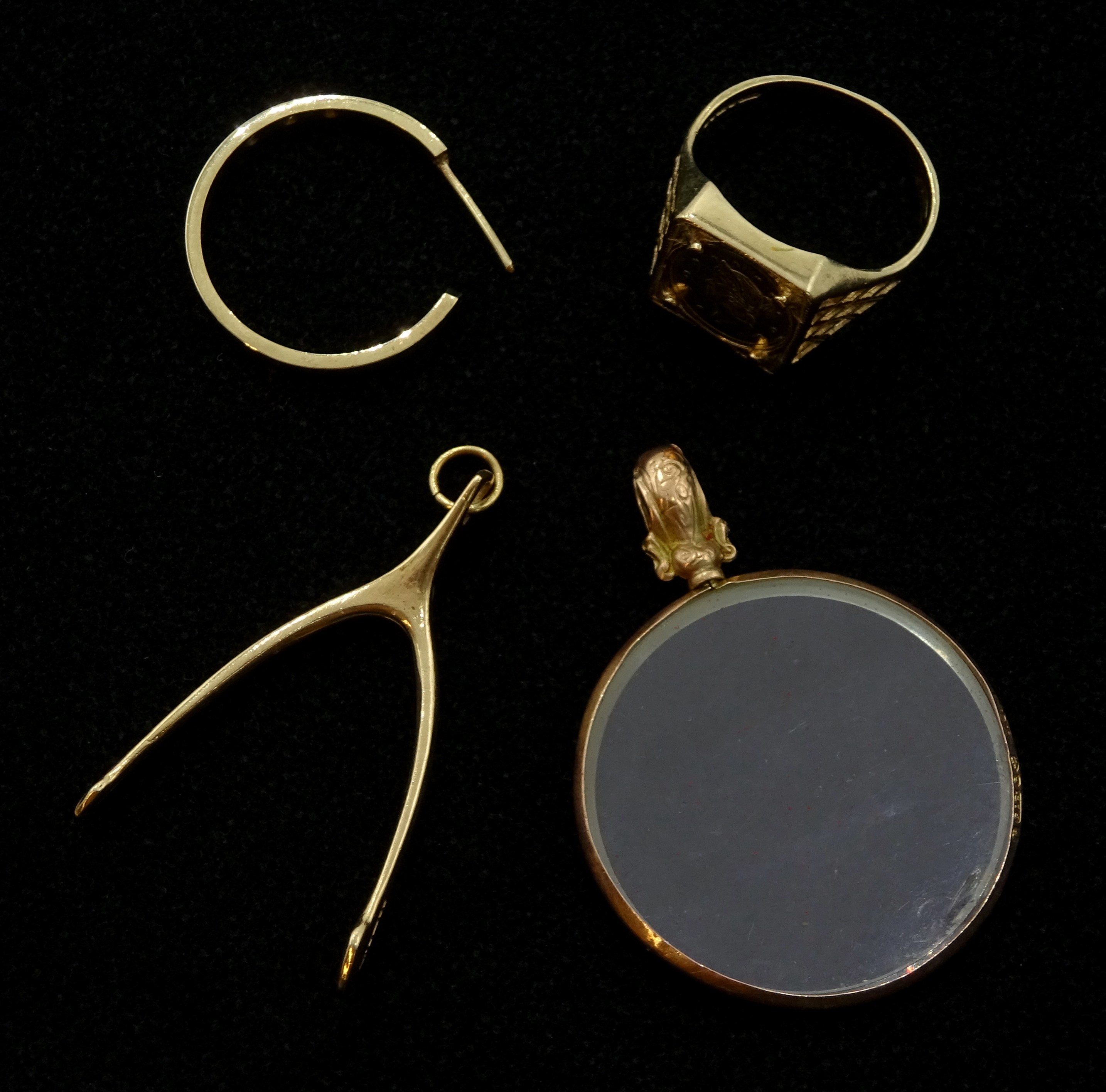 Gold wish bone pendant, half hoop earring, gold coin set ring and a gold mounted glass pendant,