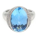 18ct white gold oval briolette cut blue topaz, with diamond surround, makers mark JD,