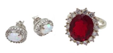 Pair of silver opal and cubic zirconia stud earrings and a silver red stone set cluster ring,