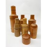 A collection of six Victorian treen bottle holders, largest H27cm,