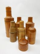 A collection of six Victorian treen bottle holders, largest H27cm,