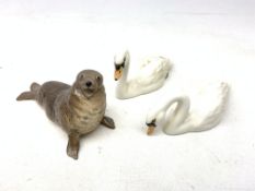 Two Beswick figurines, modelled as swans, one with impressed and printed marks beneath,
