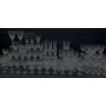 A large quantity of clear glassware, a number of examples with engraved, etched and cut decoration,