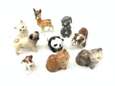 A selection of small Beswick figurines, comprising a pug, a bulldog, and a further grey dog,