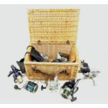 Wicker basket containing various fishing reels including Masterline 'Toothy Critter',