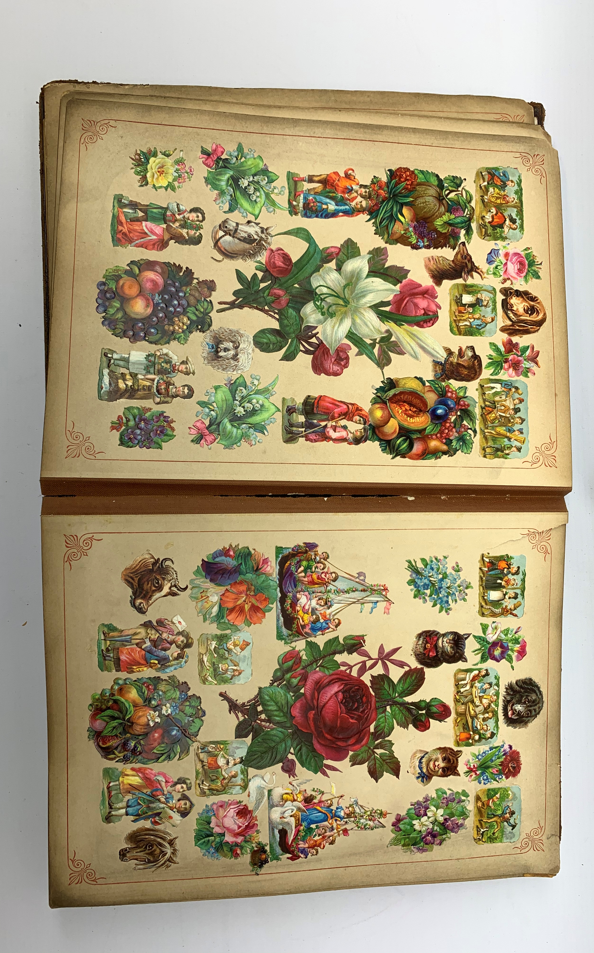 A Victorian scrap book, containing various cut outs and postcards, (binding a/f). - Image 3 of 6