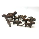 Eight cast iron and brass nut crackers in the form of dogs and another in the form of a gnome (9)