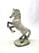 A Beswick figurine, modelled as a rearing Welsh Cob, upon a naturalistic base,
