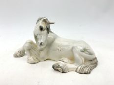 A Beswick figurine, modelled as a seated dapple grey Shire horse, with printed mark to base, L25cm.