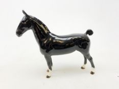 A Beswick figurine, modelled as a black Hackney horse, with printed mark beneath, H20cm.