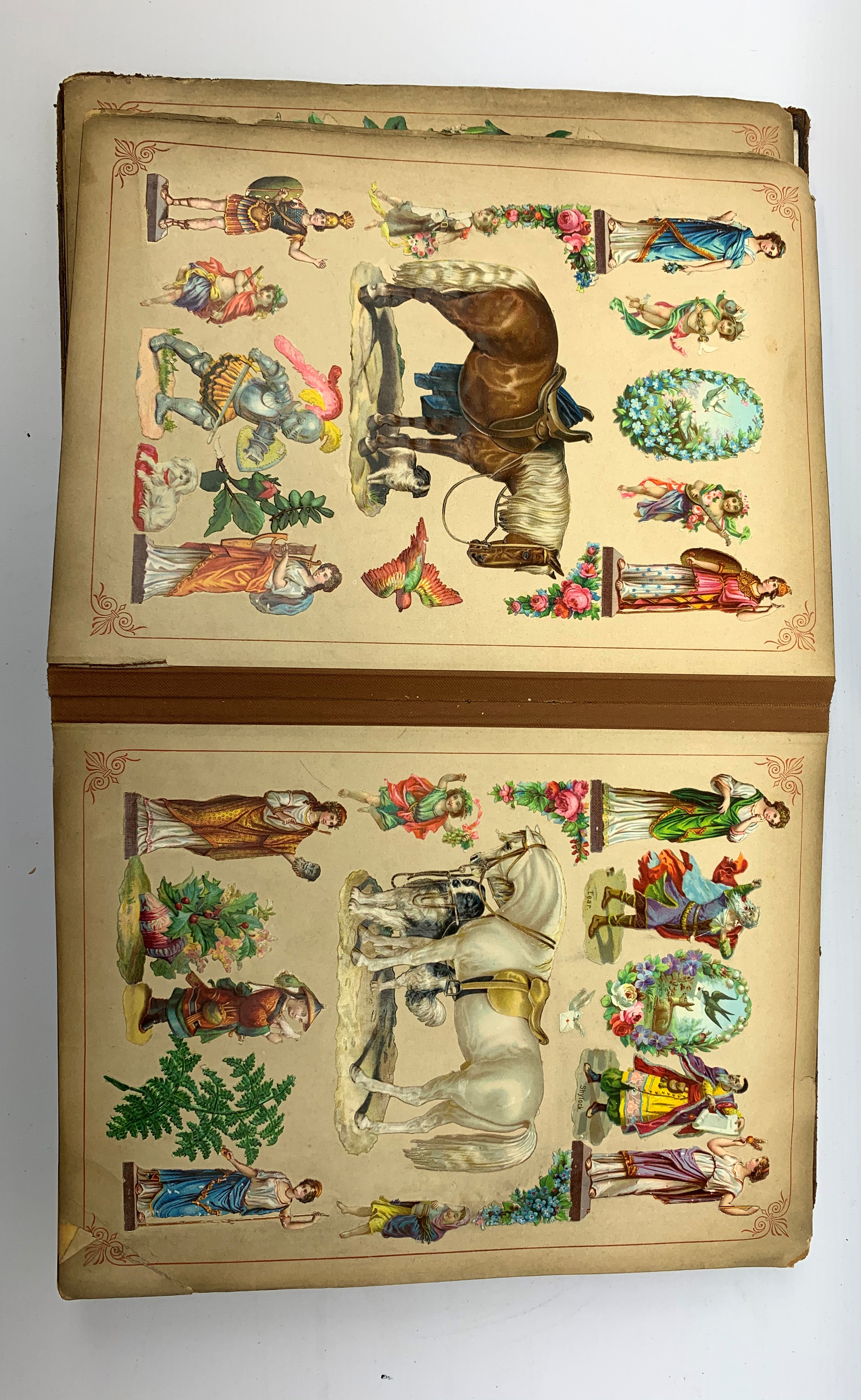 A Victorian scrap book, containing various cut outs and postcards, (binding a/f). - Image 2 of 6