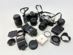 A Canon AE-1 camera, plus a Minolta Dynax 5000i camera, together with a selection of accessories,