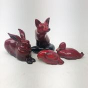 A group of four Royal Doulton Flambe animals, comprising a fox, a rabbit (a/f), a duck,