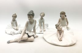 A group of five Nao figurines, each modelled as ballet dancers in various poses,