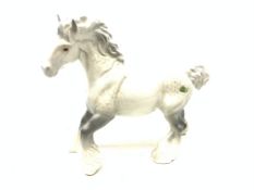 Two Beswick figurines, each modelled as a dapple grey Shire horse, each with printed mark beneath,