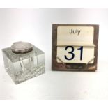 A modern silver mounted desk calendar, of plain square form with easel style support verso,