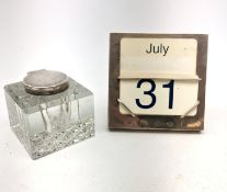 A modern silver mounted desk calendar, of plain square form with easel style support verso,