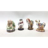 A group of four Royal Worcester candle snuffers from The Connoisseur Collection,