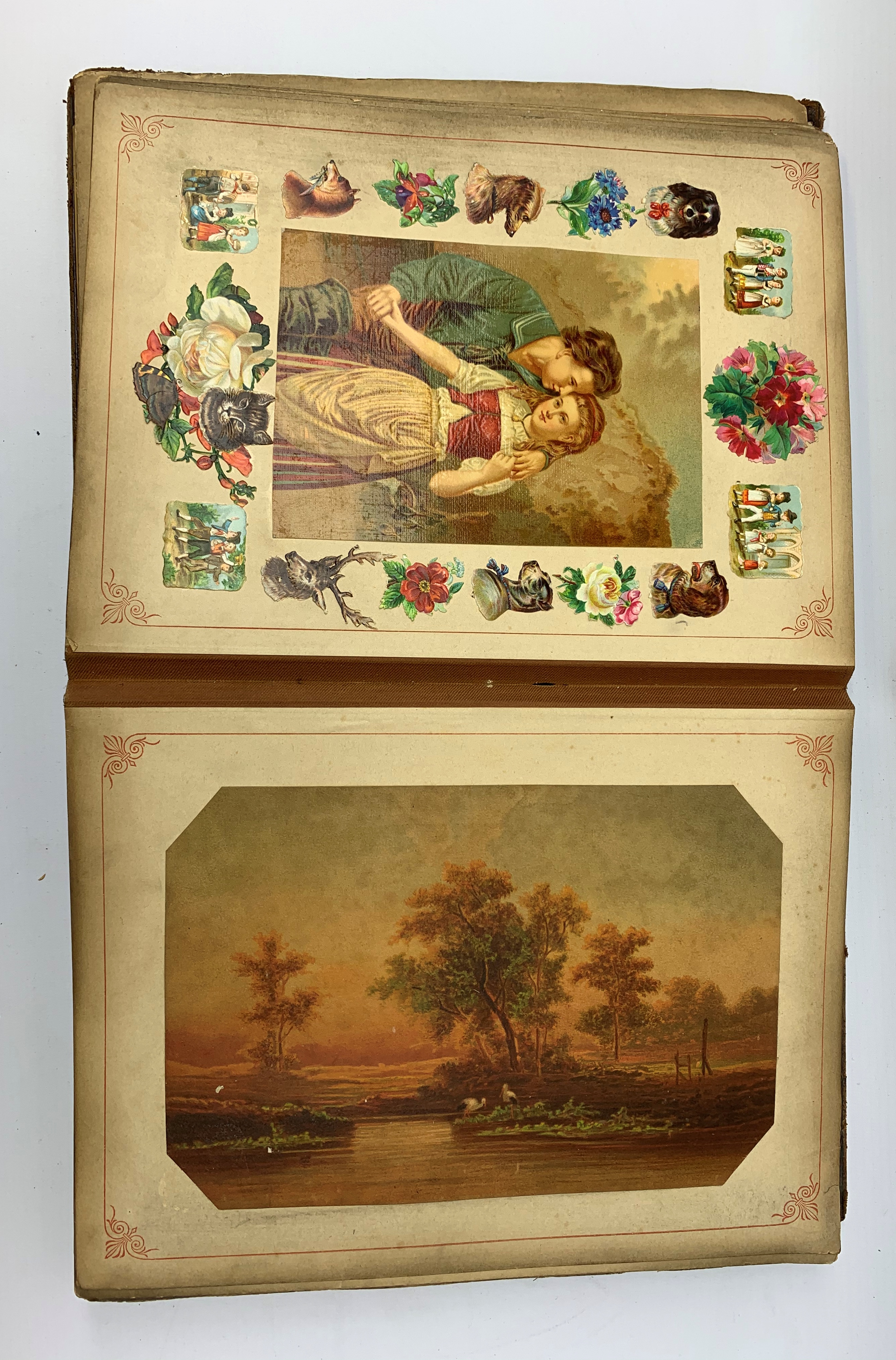 A Victorian scrap book, containing various cut outs and postcards, (binding a/f).