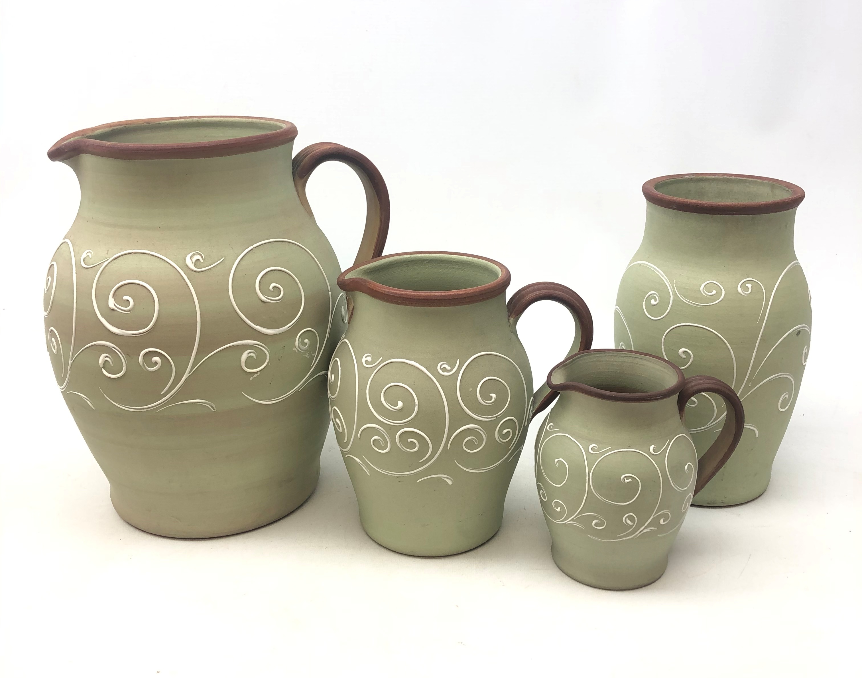 Set of three Denby Stoneware graduate jugs and matching vase decorated in the Ferndale pattern