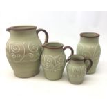 Set of three Denby Stoneware graduate jugs and matching vase decorated in the Ferndale pattern