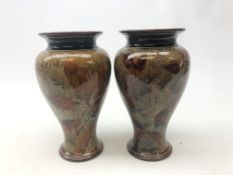 Pair Royal Doulton stoneware baluster form vases decorated in the Natural Foliage pattern,