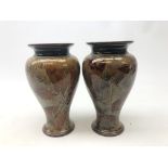 Pair Royal Doulton stoneware baluster form vases decorated in the Natural Foliage pattern,