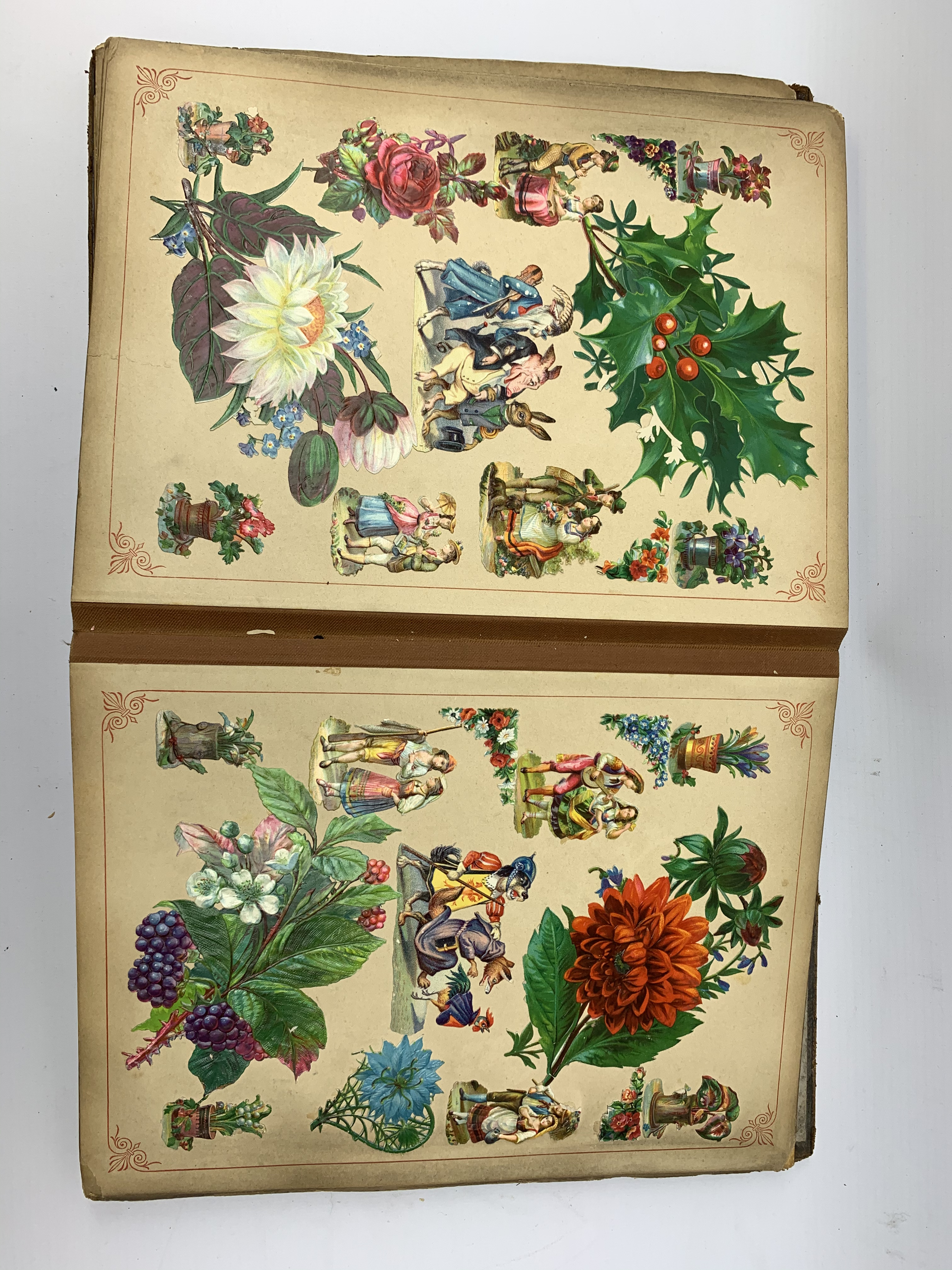 A Victorian scrap book, containing various cut outs and postcards, (binding a/f). - Image 5 of 6