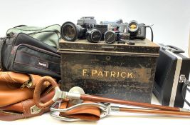 Two Vintage shooting sticks, one with leather seat, together with a Asahi Pentax Spotmatic camera,