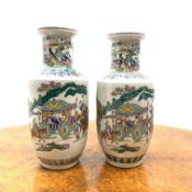 Matched pair of Chinese vases painted in polychrome enamels with figures and animals in a landscape,