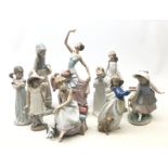 A group of four Lladro figurines, together with six Nao figurines, (some a/f), highest example H34.